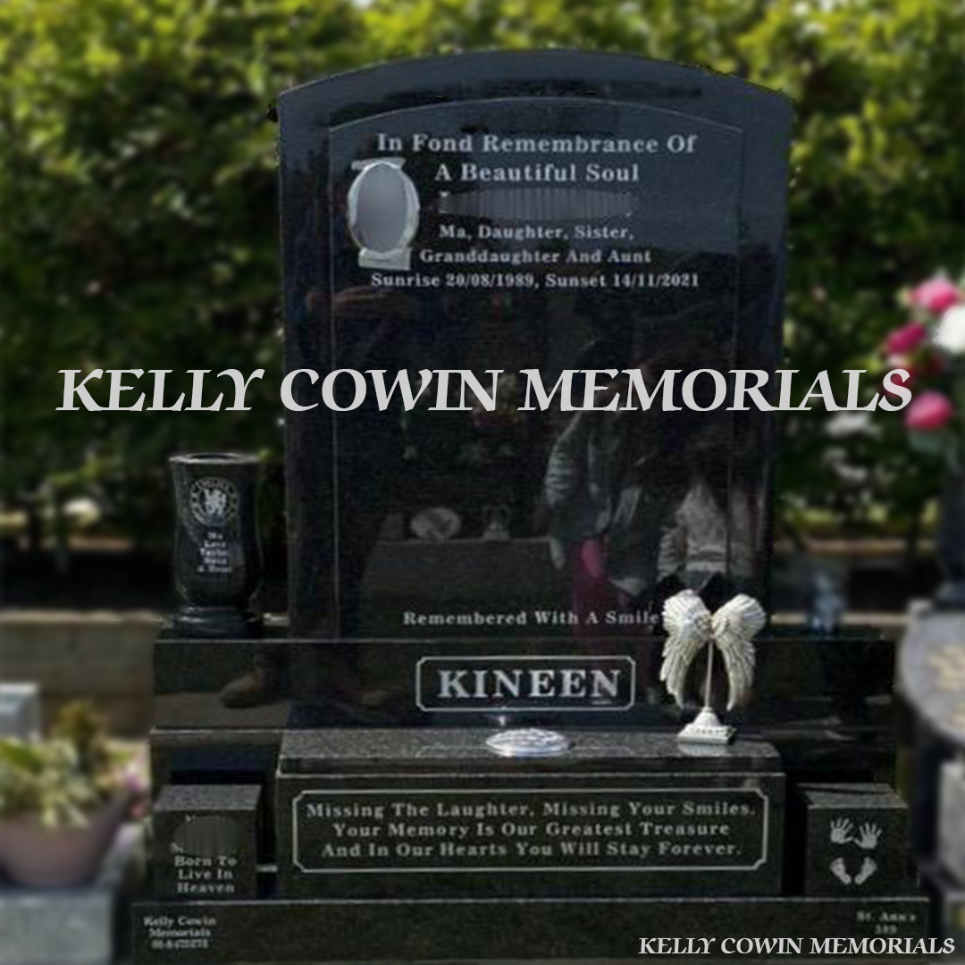 Front view of Rustenburg polished boulder headstone with raised face and silver inscription in Balgriffin Cemetery Dublin