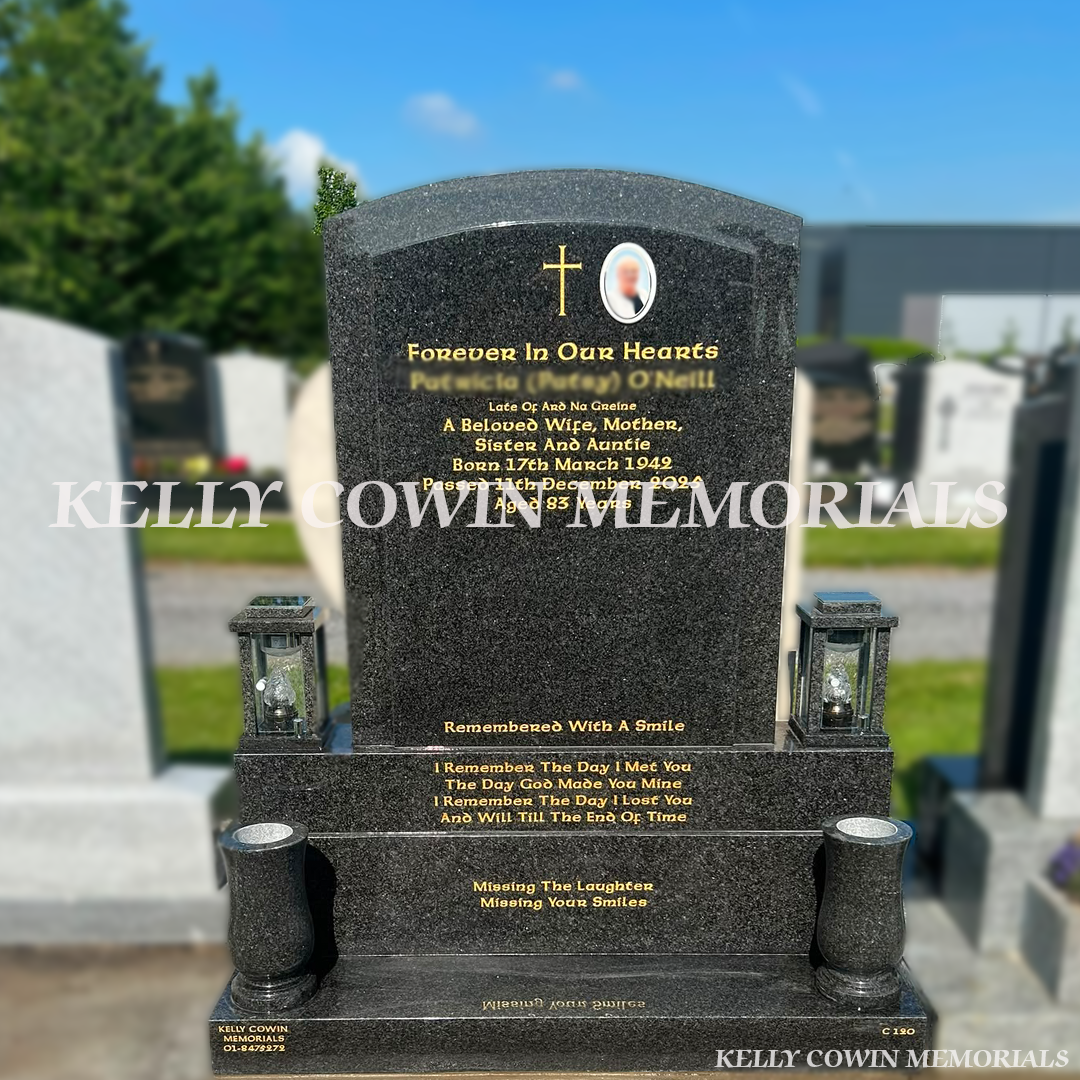 Rustenburg polished boulder headstone with gold leaf inscription, ceramic photo, granite vases and lanterns installed in Dardistown Cemetery by Kelly Cowin Memorials.