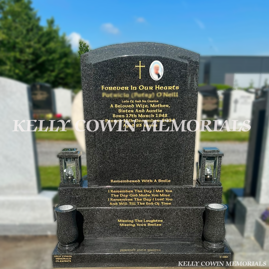 Rustenburg polished boulder headstone with gold leaf inscription, ceramic photo, granite vases and lanterns installed in Dardistown Cemetery by Kelly Cowin Memorials.