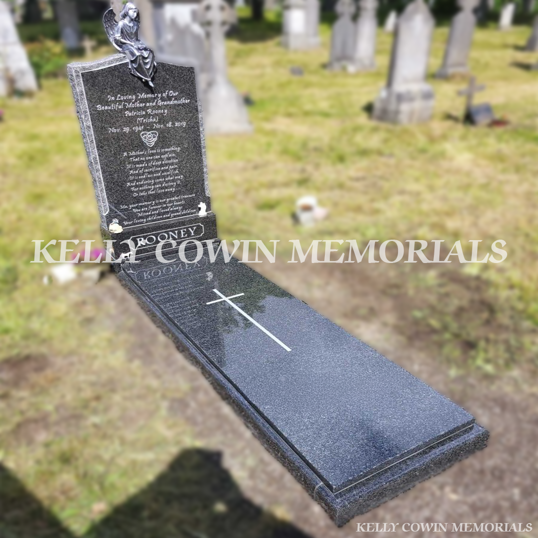 Side view of Rustenburg OG granite memorial with rough-cut edges installed in Glasnevin Cemetery by Kelly Cowin Memorials.
