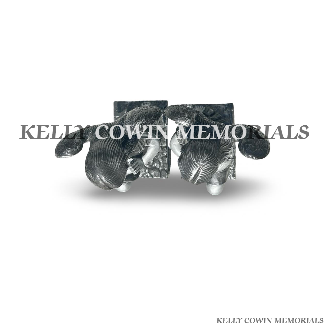 Top view of silver kneeling angel memorial statues