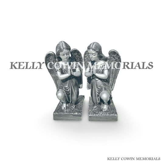 Front view of silver kneeling angel memorial statues