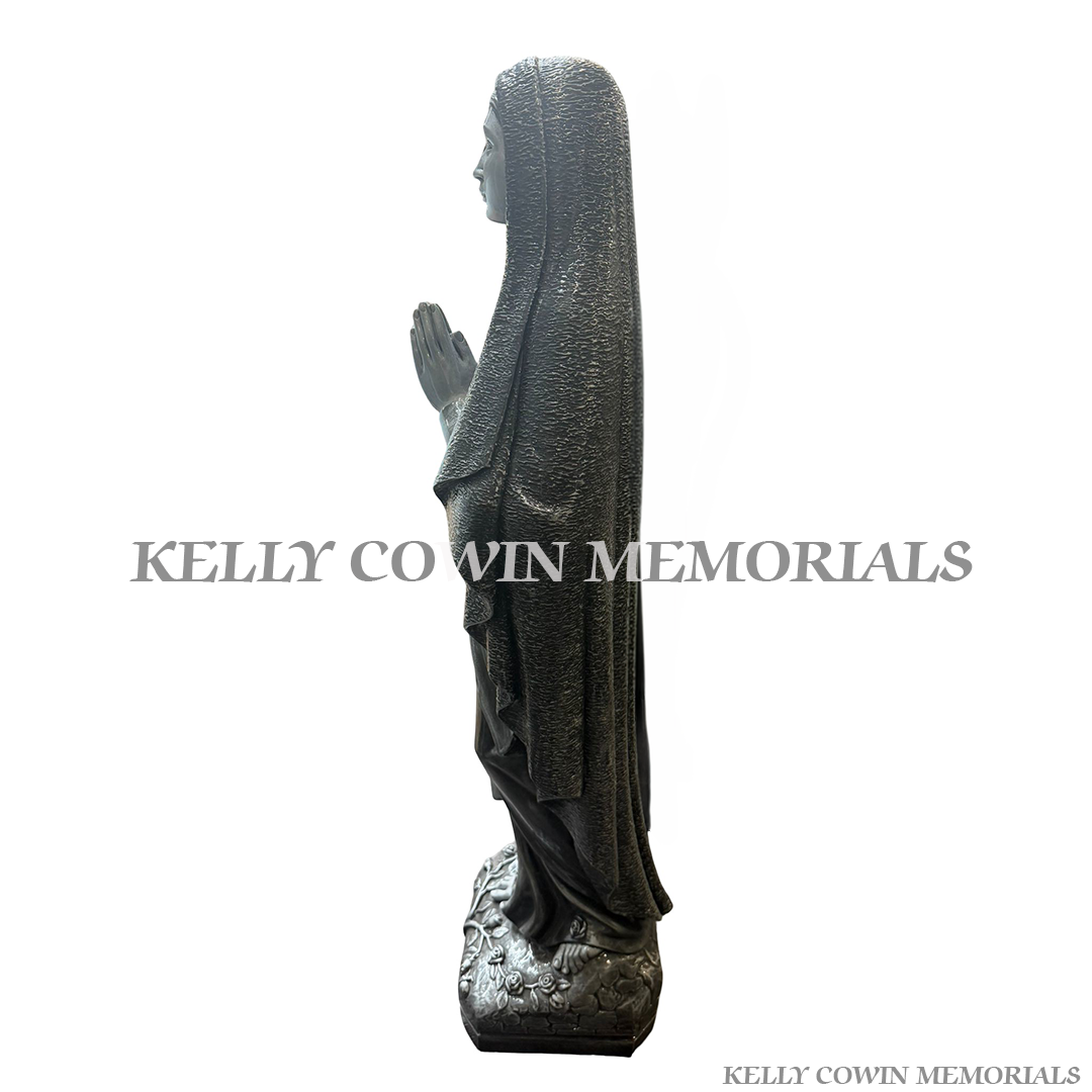 Side view of silver Our Lady religious memorial statue for grave decoration in Ireland
