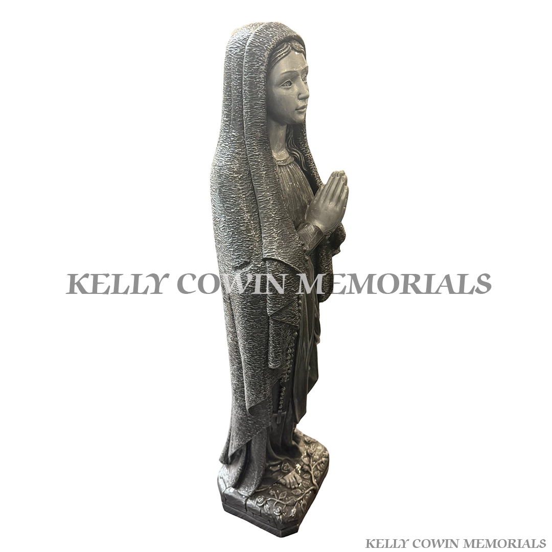 Side view of silver Our Lady religious memorial statue for grave decoration in Ireland