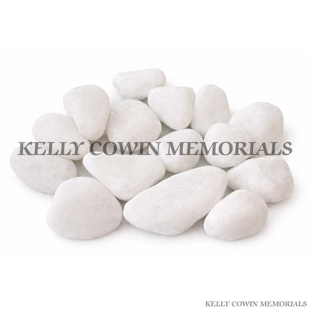 Snowy white decorative pebbles for grave memorial supplied in Dublin by Kelly Cowin Memorials with nationwide delivery across Ireland.