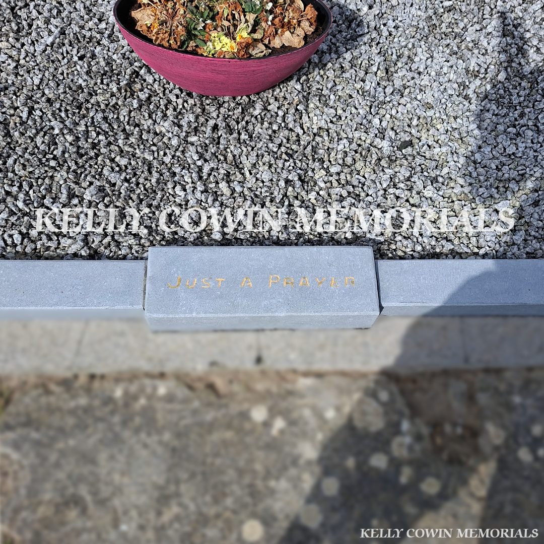 Close-up of restored gold lettering and cleaned limestone kerbing after renovation
