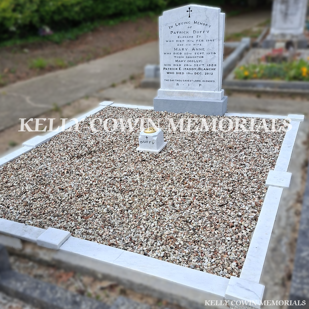 After renovation of restored white marble memorial with black repainted lettering