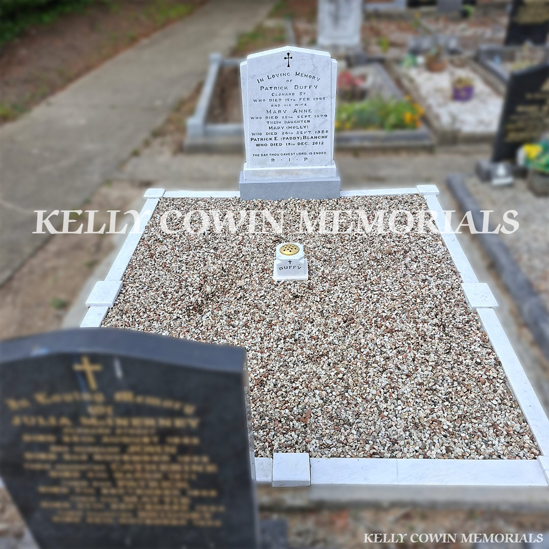 After renovation of restored white marble memorial with black repainted lettering