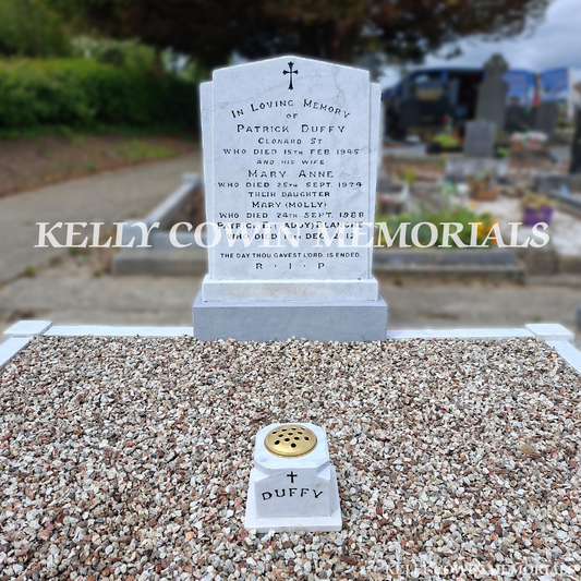 After renovation of restored white marble memorial with black repainted lettering