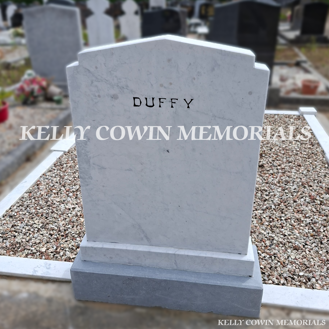 After renovation of restored white marble memorial with black repainted lettering