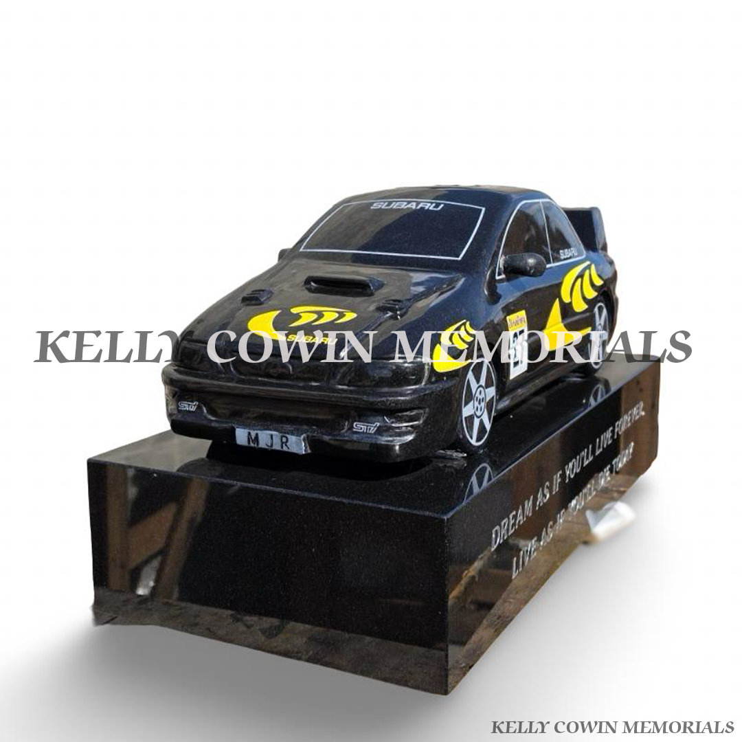 Angled view of bespoke black granite Subaru rally car memorial mounted on personalised polished granite plinth.