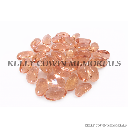 Sugar pink glass pebbles for grave memorial supplied in Dublin by Kelly Cowin Memorials with nationwide delivery across Ireland.