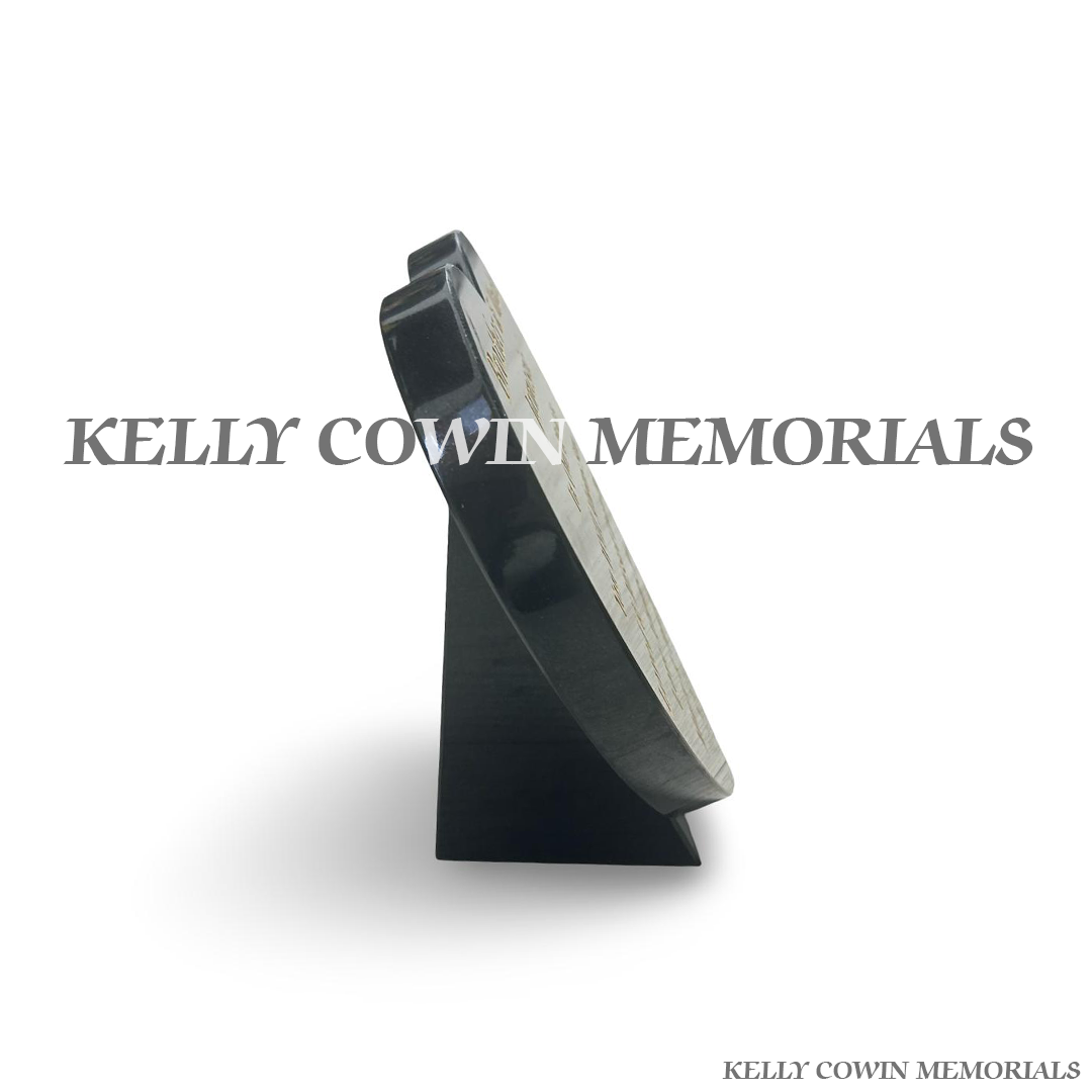side view of Black granite 12 inch heart-shaped memorial plaque with polished finish and 23.5-carat gold engraved inscription, handcrafted by Kelly Cowin Memorials for personalised memorials throughout Dublin and Ireland.