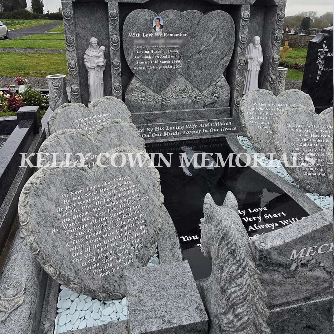 Carved granite hearts with personalised inscriptions and central heart headstone in Creagh Cemetery Ballinasloe.