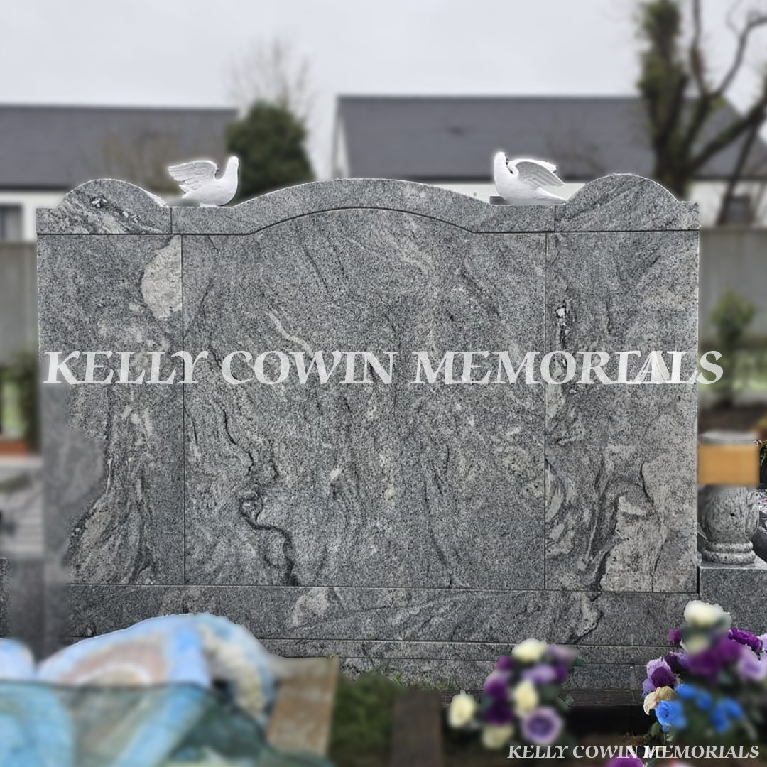 Rear view of custom Viscount White granite heart memorial with carved top and dove ornaments in Creagh Cemetery Ballinasloe.