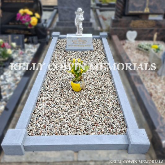 After renovation of restored limestone kerbing and white marble angel statue