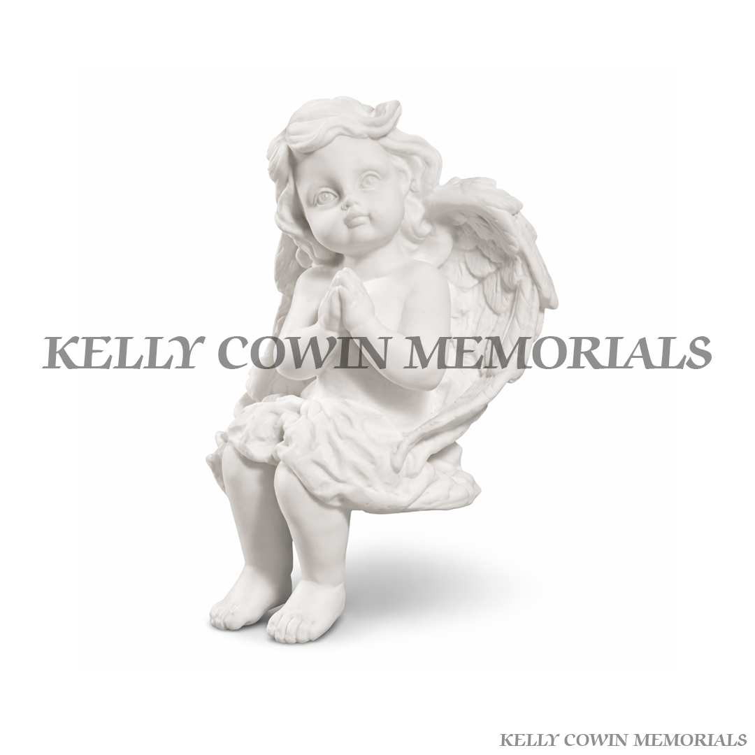 White praying angel memorial statue with folded hands, suitable for grave or headstone remembrance in Ireland