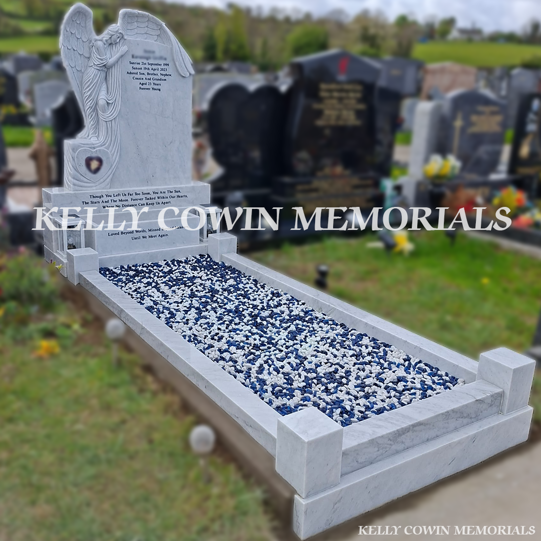 Side view of white marble memorial with kerbing and chippings