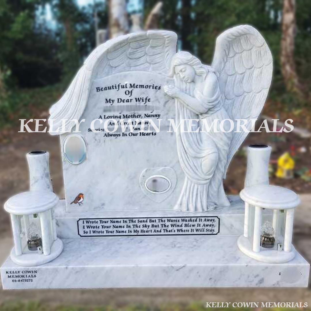 Front view of white marble angel headstone with black inscription and ceramic photographs in Newlands Cross Cemetery