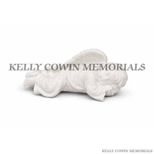 White glazed sleeping angel memorial ornament for graves and headstones by Kelly Cowin Memorials Dublin Ireland with nationwide delivery and installation